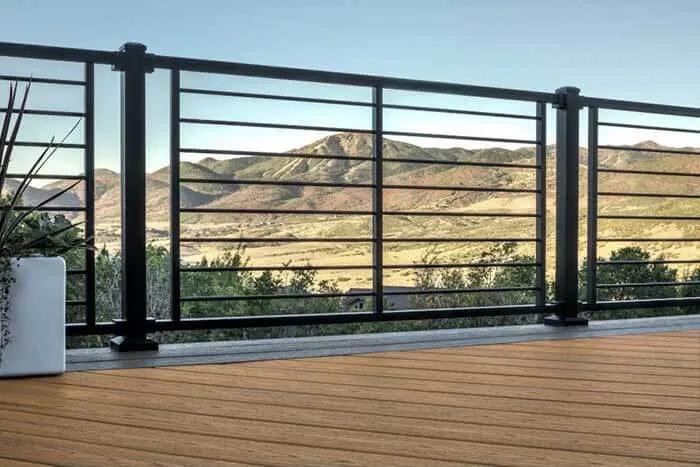 Horizontal rod railing on a composite deck balcony.